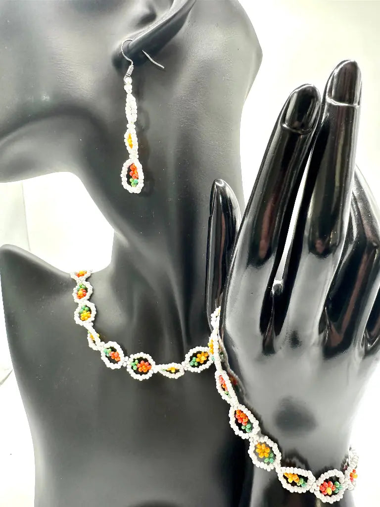 Jewellery set with necklace and earrings on a mannequin hand